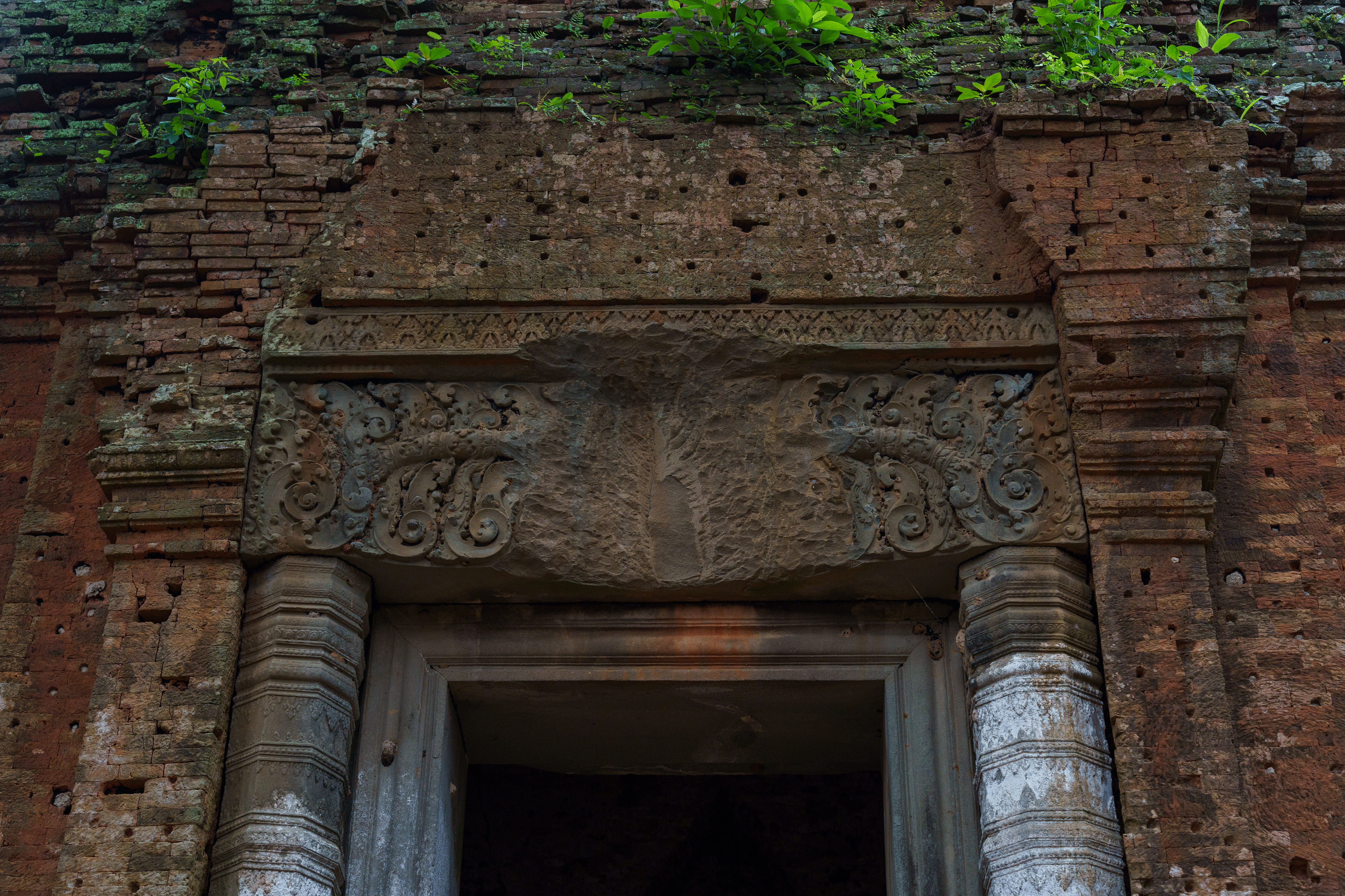 The remains of a bas-relief over a door of one of the temples of Prasat Thom, Koh Ker in Cambodia are seen on Aug. 10, 2022. The complex was one of the most targeted by looters. (Photo by Thomas Cristofoletti/Special to The Denver Post)