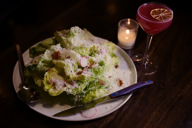 Butter Lettuce + tarragon (pickled shallot, sunflower seeds and ricotta salta) and future me problem (house cocktail, milagro reposado, spiced orange, cranberry, beet, almond and lime) at Annette in Stanley Marketplace in Aurora on Tuesday, Nov. 28, 2023. (Photo by Hyoung Chang/The Denver Post)