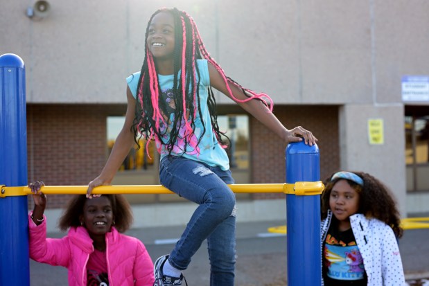 From left, Awa, 9, Mariah, 9, and Athena, 9, (last name not identified) play during a Scholars Unlimited after school program at Place Bridge Academy in Denver on Nov. 1, 2023. (Photo by Hyoung Chang/The Denver Post)