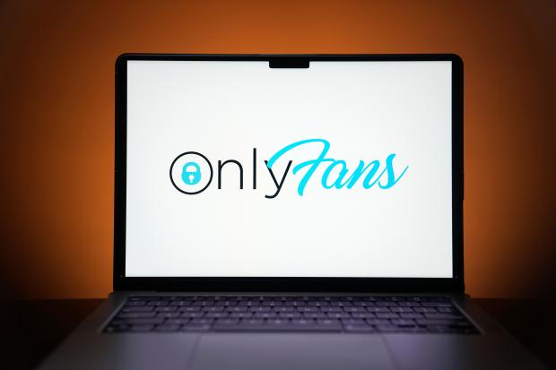 The OnlyFans logo is seen on a computer monitor in...